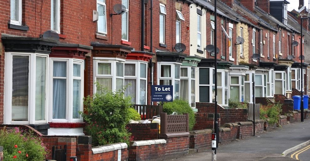street of residential properties with a to let sign - Bowling & Co