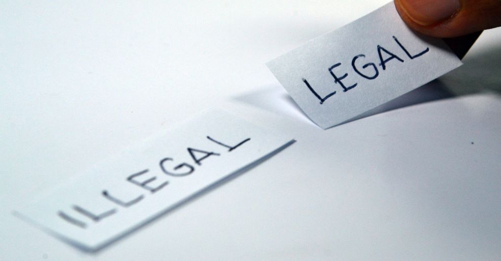 paper with legal and illegal written on it